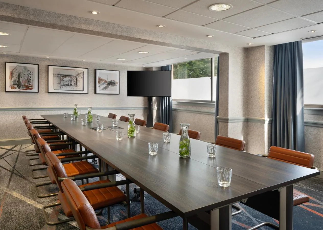 a large conference room with a long table and chairs at Glasgow Marriott Hotel in Glasgow